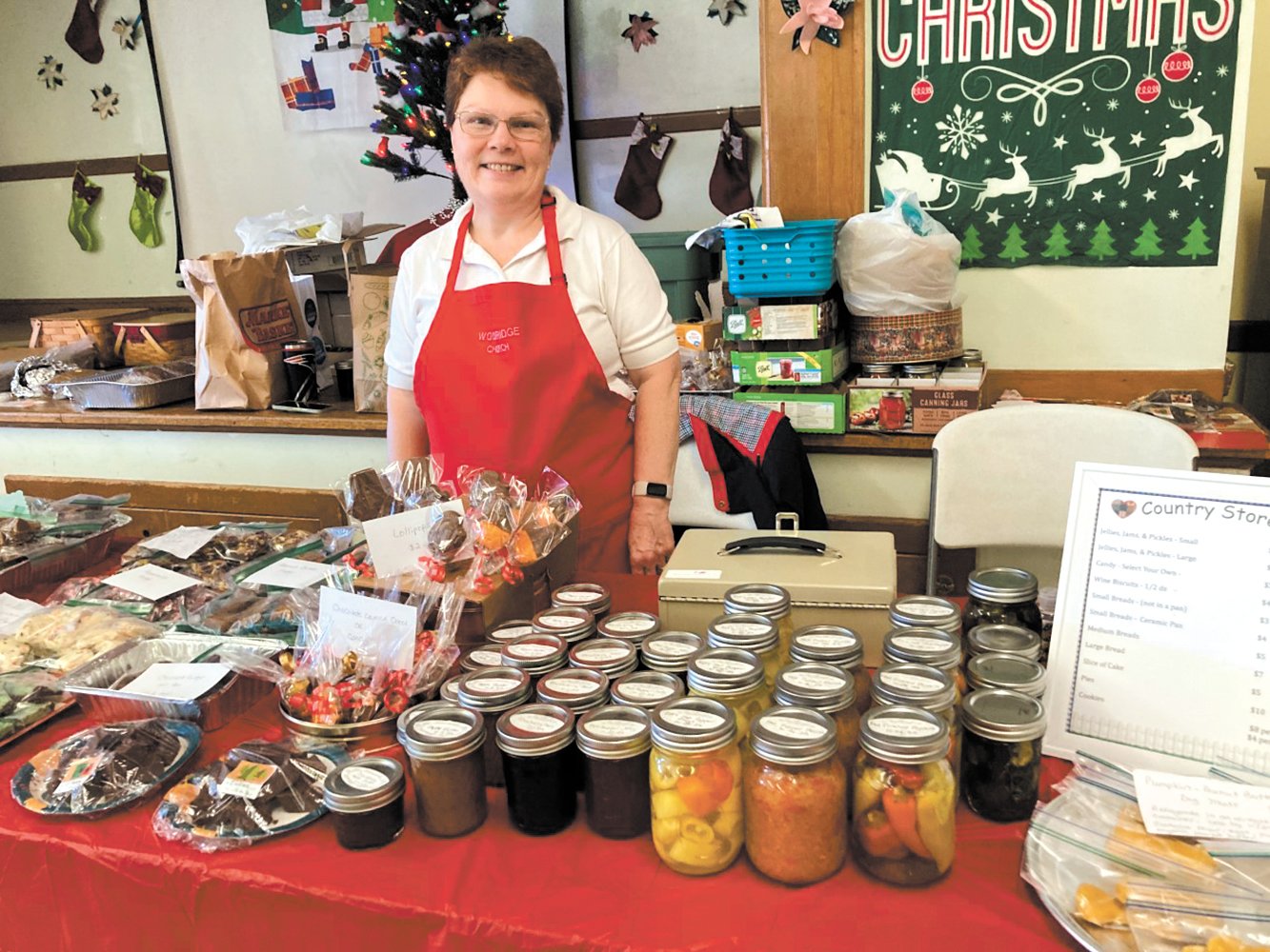 FOR THE FOODIES: If you were looking for a tasty selection of goodies on Saturday, parishioner Debbie Therrien had you covered at the church’s country store section. An assortment of fudge, jams, pickles, pies, breads and homemade dog biscuits were among the fast-selling items.